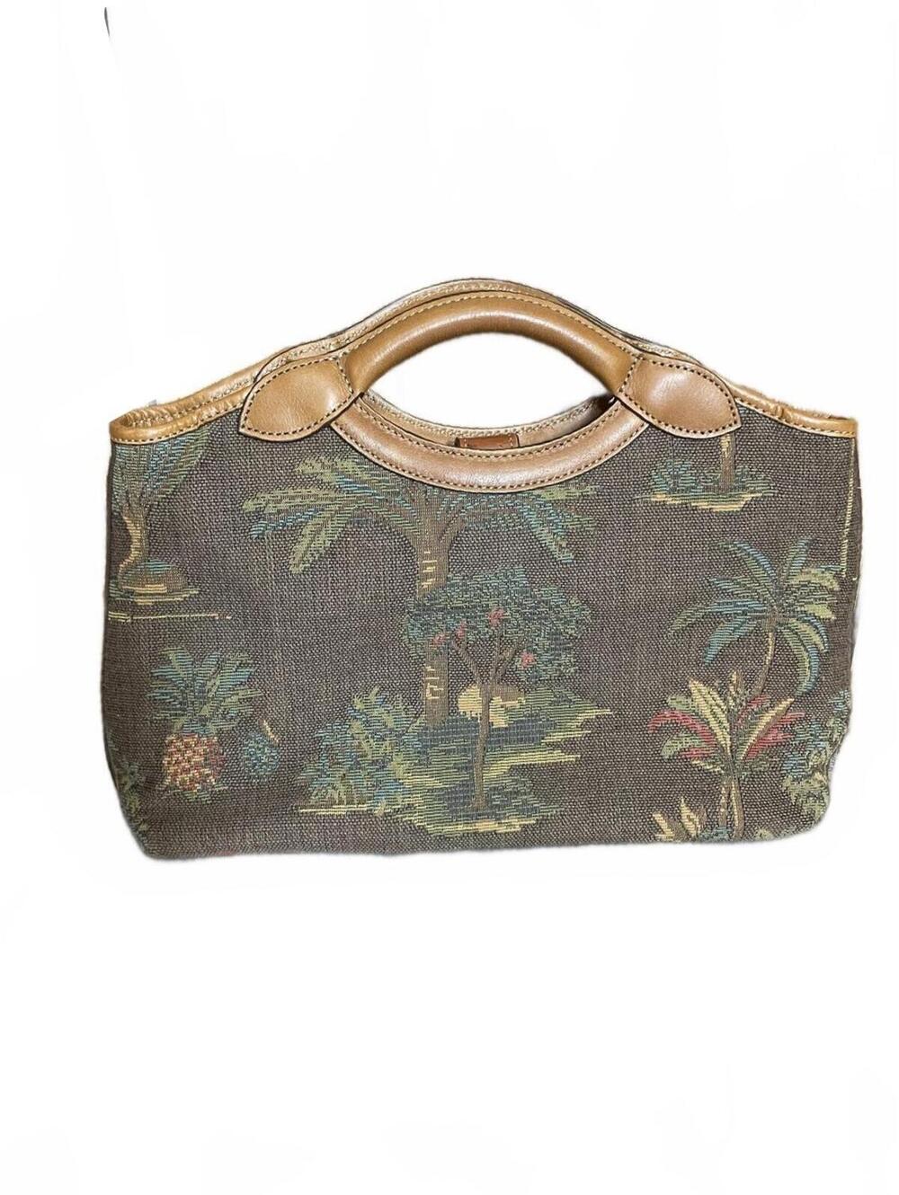 Tommy Bahama tapestry and leather handbag with tropical palm tree scene.